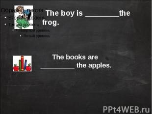 The boy is ________the frog.