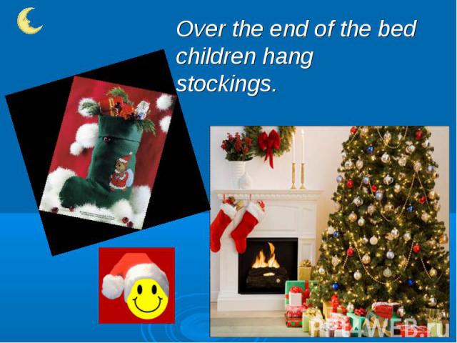 Over the end of the bed children hang stockings.