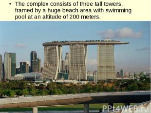 The complex consists of three tall towers, framed by a huge beach area with swim